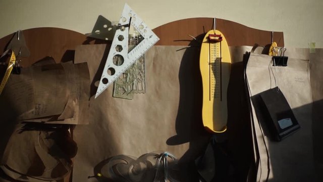 Designer drawing apparatus and instruments on the wall in office