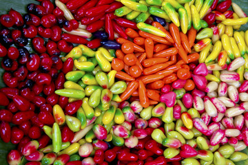 small imitated fruits as a Thai sweet snack called Look chub LOOK CHUB --Traditional Thai Snack Made of Green Bean, Fruit Imitating