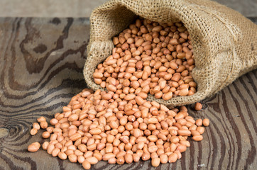 Peanut in bags on wood table