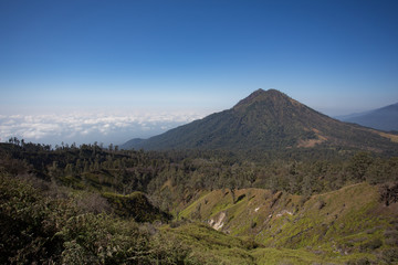 Fototapeta premium View from the tropical forest with path to the volcano Kawah Ije