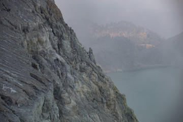 Sulfur mine with workers in Kawah Ijen, Java, Indonesia