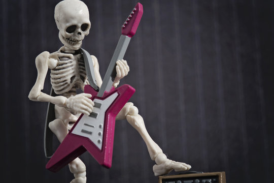 A Skeleton Solo With His Electric Guitar