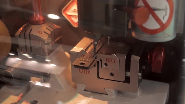 Machine for manufacturing duplicate keys to the castle makes automatic. Closeup