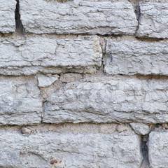 Fragment of an old brick wall