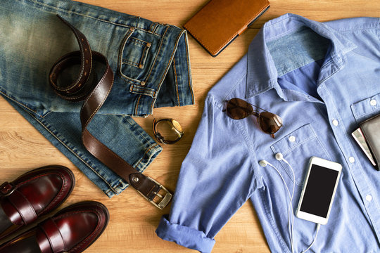 Flat lay of men casual fashion outfits on wooden background
