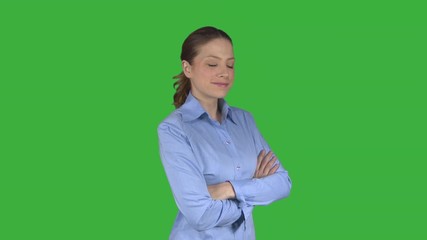 Happy arms crossed working female professional (Green Key)