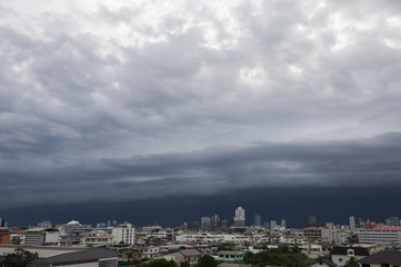 Aerial view of Bangkok city, under blue storm cloudy sky