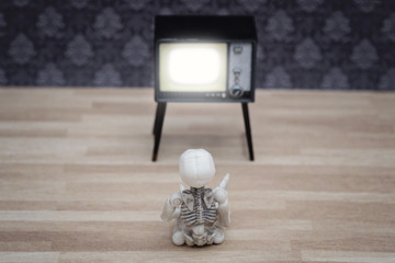 Little skeleton watching TV