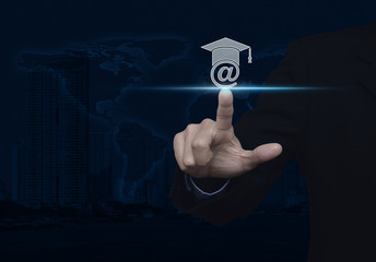 Businessman pressing e-learning icon over map and city tower, St