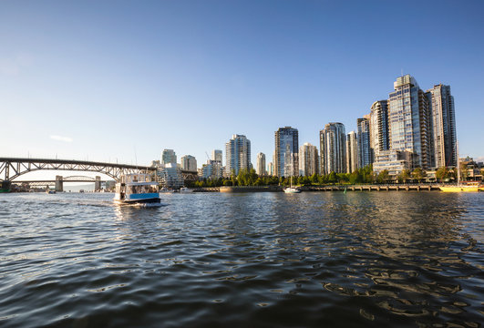 View on Residential buildings and bridges at False Creek in Downtown Vancouver. Taken from the water point of view.