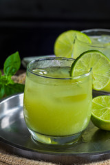 Iced green tea cocktail with tequila and lemon