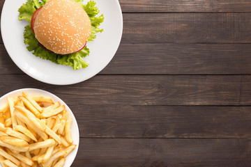Top view bbq hamburger and french fries on the wooden background