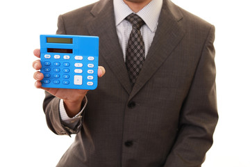 計算機を持つビジネスマン