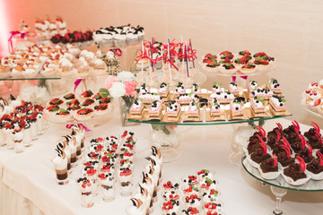 Different kinds of baked sweets on a buffet
