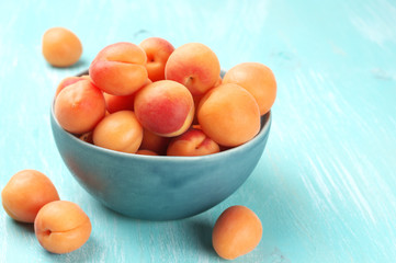 Apricots in blue bowl