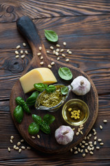 Still life with freshly made basil pesto and its ingredients