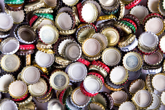 a lot of caps of beer, top view