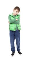 Full length portrait of a bored little boy with arms folded