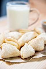 Fresh baked cheese cookies with milk, closeup