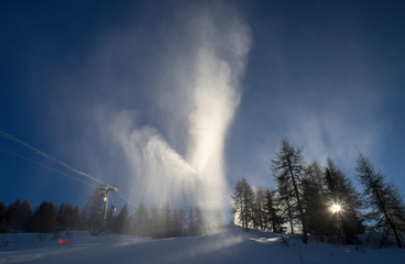 ?rtificial snow. Snow sun and rainbow.