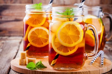 ice tea with slice of lemon in mason jar