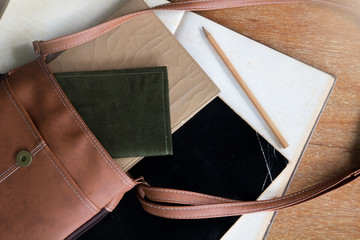 Old Brown Shoulder bag with pocket book , old diary book , old notebook ,and pencil 