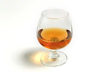 Printed kitchen splashbacks Alcohol amber whiskey in snifter glass on white background