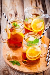 ice tea with slice of lemon in mason jar