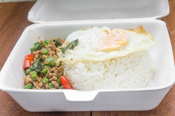 Rice topped with stir fried minced pork and basil. Thai food
