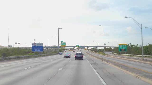 Driving on a highway with interchange