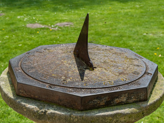 Sun clock in a park on a sunny day