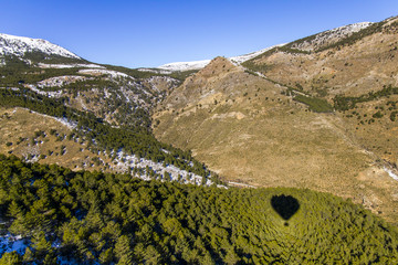 Hot air balloon over the mountains of Sierra Nevada in south Spain.