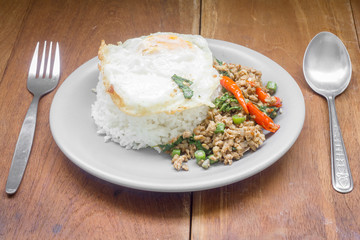 Rice topped with stir fried minced pork and basil. Thai food