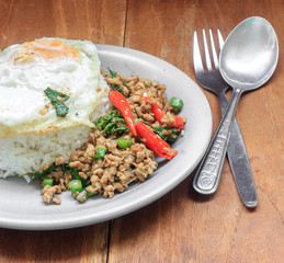 Rice topped with stir fried minced pork and basil. Thai food