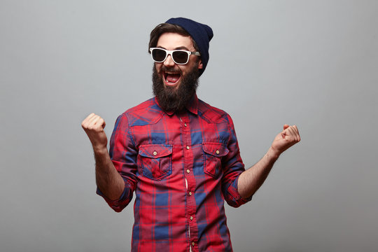 Happy Hipster Man With Beard Exults