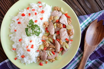 Roasted chicken meat with stalk celery, roasted walnuts and rice