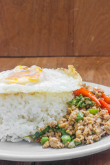 Rice topped with stir fried minced pork and basil. Thai food
