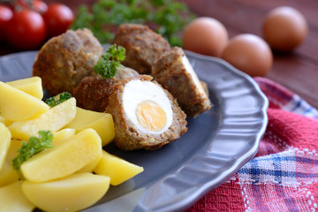 Scotch eggs with boiled potatoes