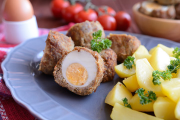 Scotch eggs with boiled potatoes