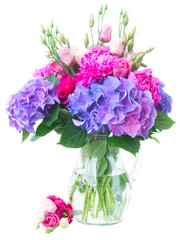 Bright pink peony, eustoma and blue hortensia flowers bouquet isolated on white background