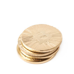Pile of bitcoin currency tokens isolated