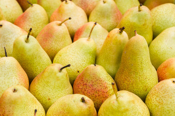 Delicious ripe pear in the store on the counter