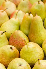 Delicious ripe pear in the store on the counter