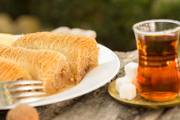 Tasty Turkish dessert with traditional Turkish tea