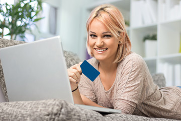 Fototapeta premium Beautiful girl holding credit card