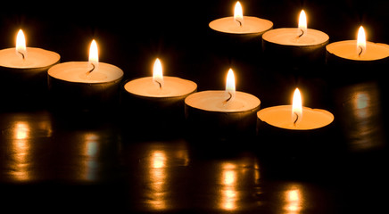 burning candles black background