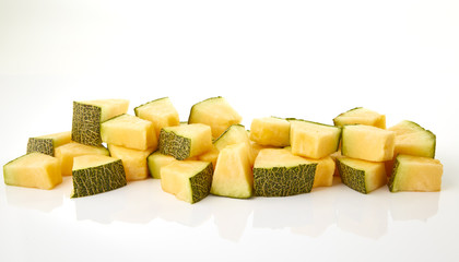 Hamigua Melon cut into slices, Hami Melon, Hami Cantaloupe isolated on white background.
