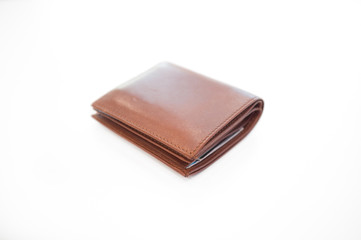 Brown leather wallet, selective blur on part of object for depth of field, on isolated white background