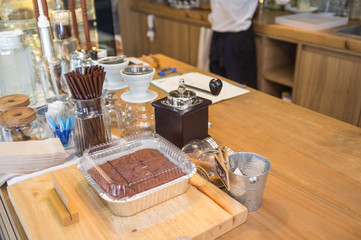 Bakery and coffee equipment on coffee shop counter, with copy space on right side for text
