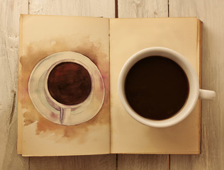 Photo of old book with coffee cup and coffee drawing